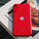 The 2020 iPhone SE on top of a cookbook
